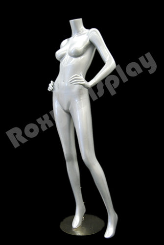 Female mannequin headless, with both hands on waist